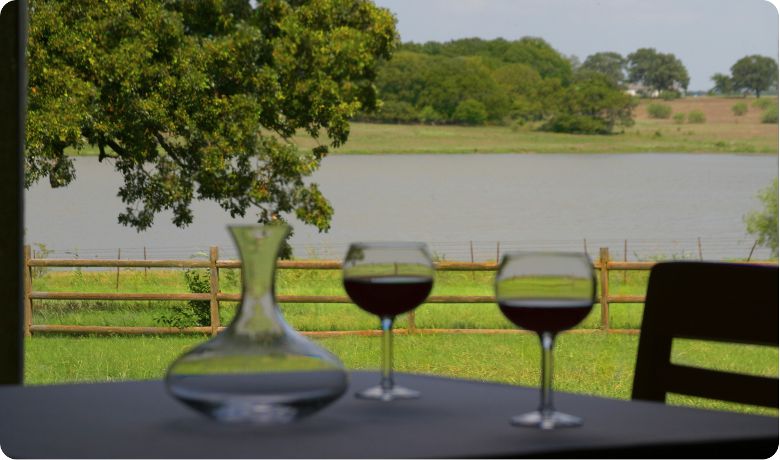 A view of the water and wine from inside of Four Winds Steakhouse.